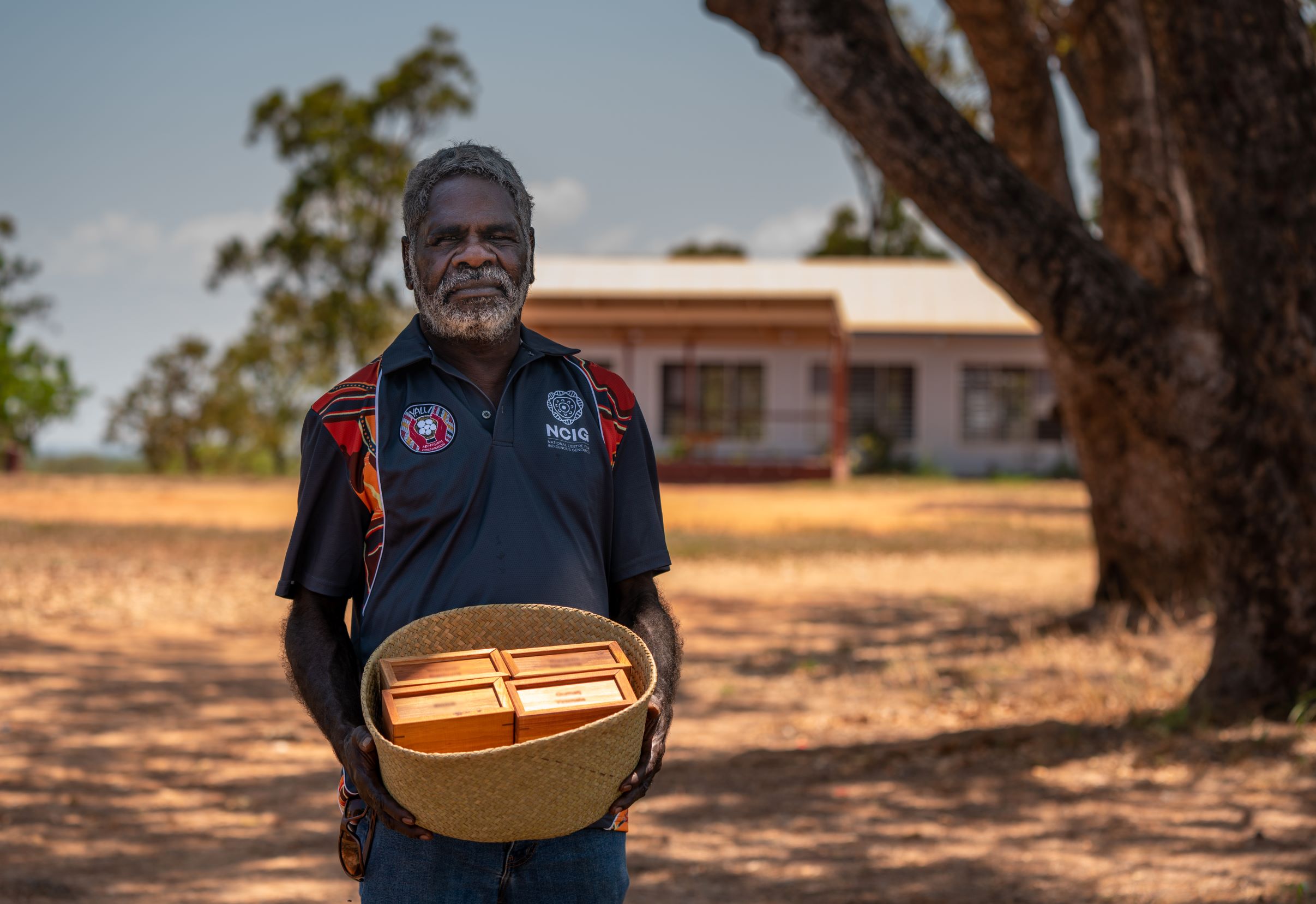 R M Wunungmurra holding a basket of repatriated bio-samples. R M Wunungmurra holding a basket of repatriated bio-samples.